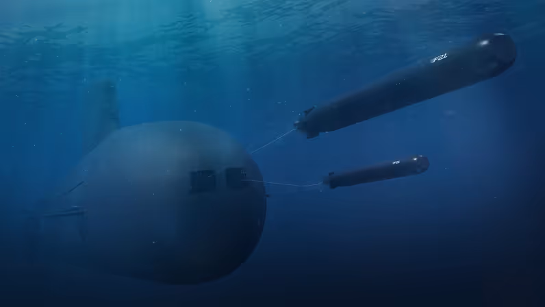 Twee F21’s verlaten een onderzeeër onder water.