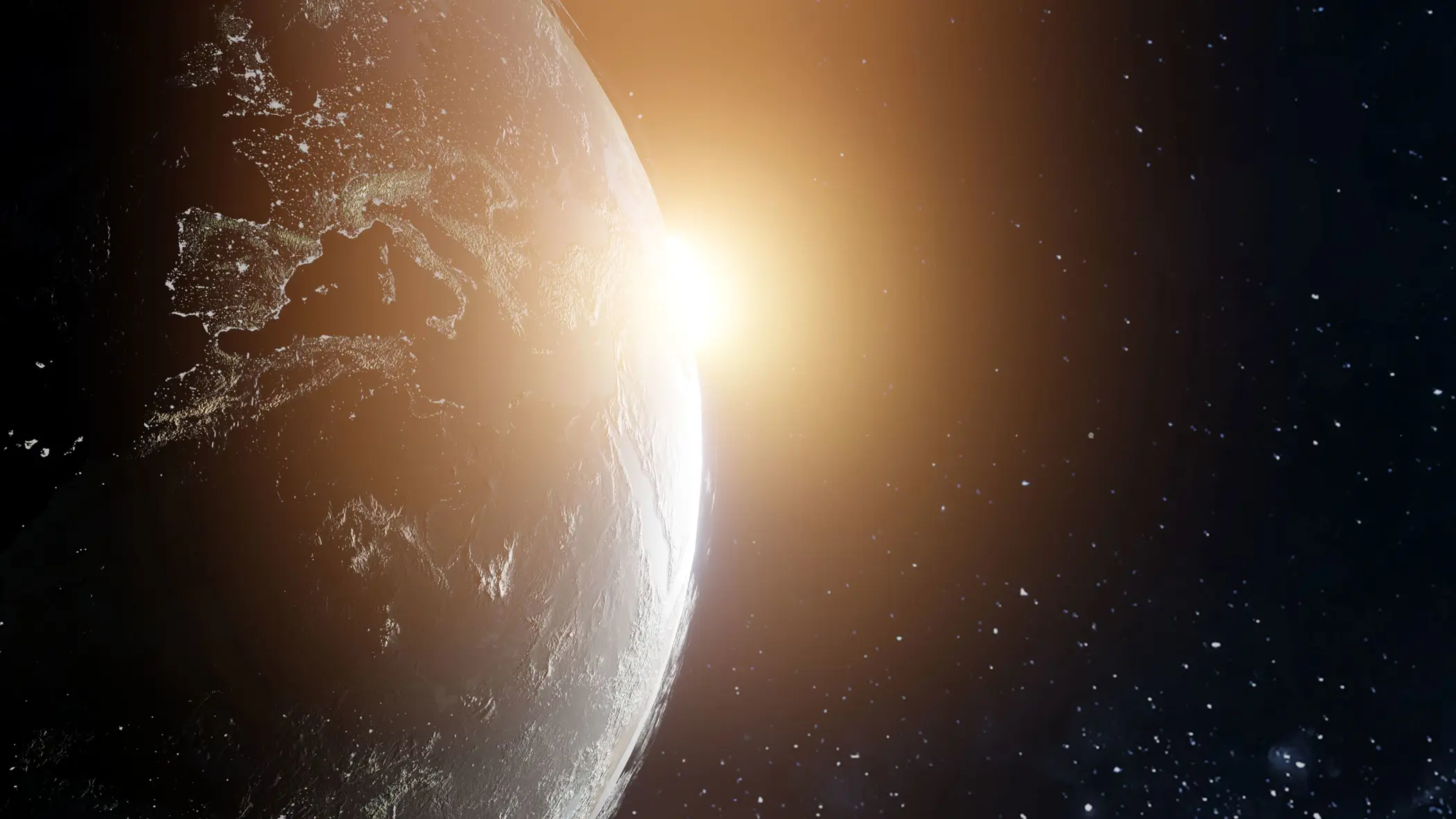 De wereld vanuit de ruimte gezien. Aan de zijkant komt de zon achter de aardbol tevoorschijn.
