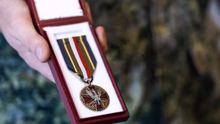 Poolse medaille in doosje.