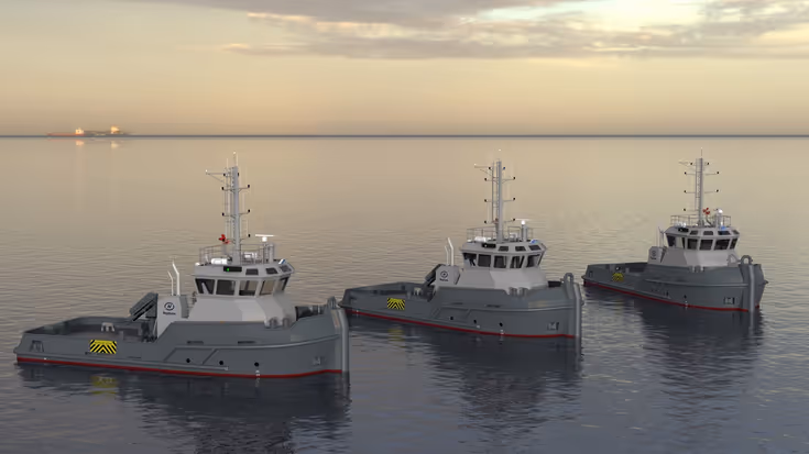 3 grijze sleepboten met witte kajuit in het water met de neuzen naar rechts.