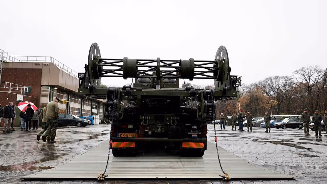 Systeem voor wegenmattenlegger.